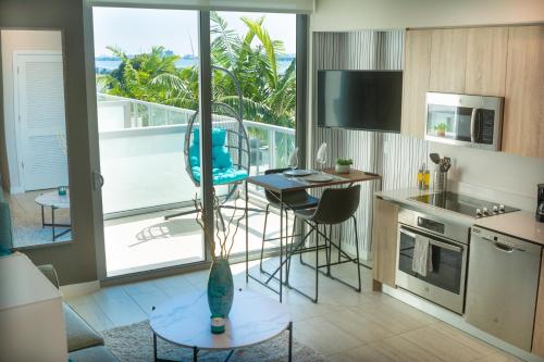 a kitchen with a view of the ocean at Luxury Oceanview Studio at Miami Design District in Miami