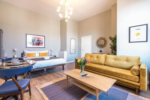 a living room with a couch and a table at Host & Stay - The Georgian Quarters at Bedford in Liverpool