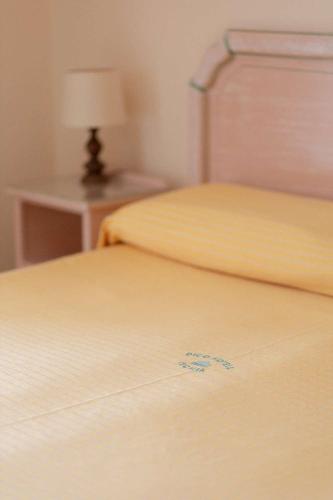 a close up of two beds in a room at Hotel Royal Terme in Ischia