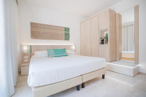 Postel nebo postele na pokoji v ubytování Felix Hotels - Hotel La Coluccia