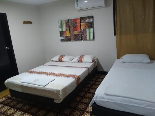 Cama o camas de una habitación en EL Dorado Hotel Maicao