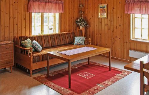 a living room with a couch and a table at Stunning Home In Gll With 1 Bedrooms in Gällö