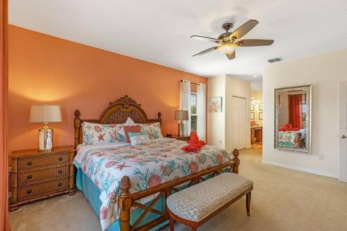 a bedroom with a bed and a ceiling fan at 535 -Villa Belvedere, A Stunning, Spacious 5 Bed Lake View Home with Pool and Spa in Davenport