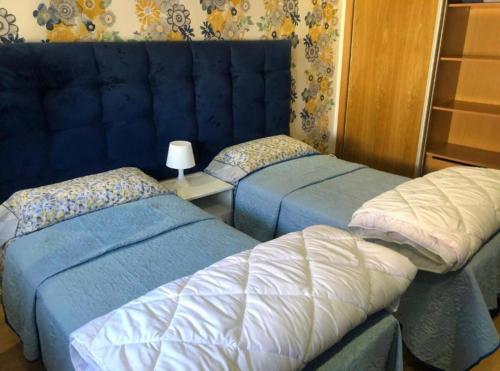 Кровать или кровати в номере CalmA