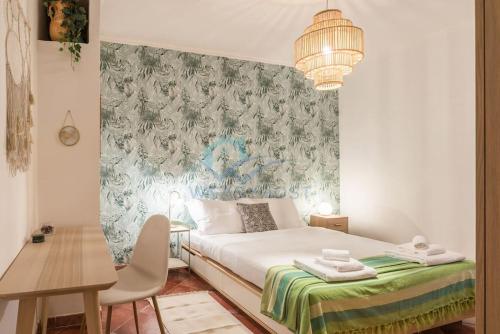 Llit o llits en una habitació de Tiny secret garden in Trionfale
