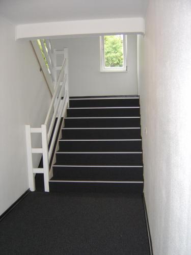 a stair case in a building with a window at B&B Pommerloch in Pommerloch