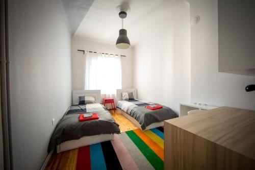 A bed or beds in a room at White Tower Minimal Apartment