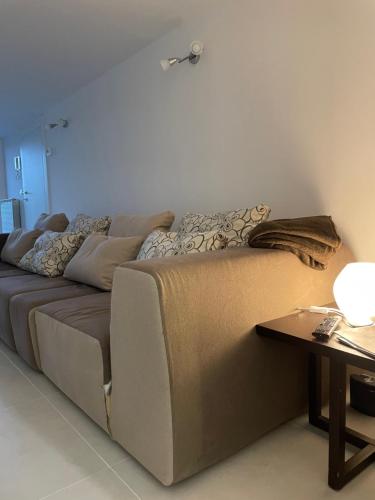 a large couch in a room with a table at La casa de lu Barone in San Demetrio neʼ Vestini