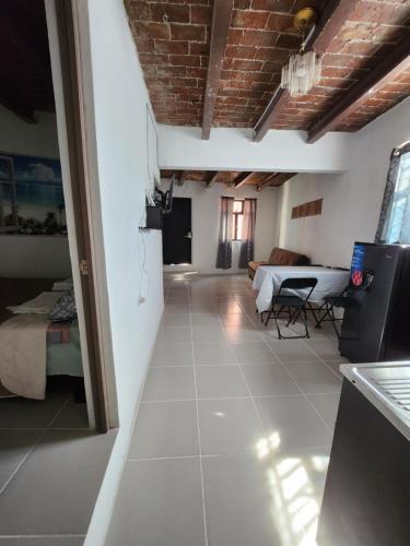 a living room with a couch and a table at Casa Linda Vista in Guanajuato