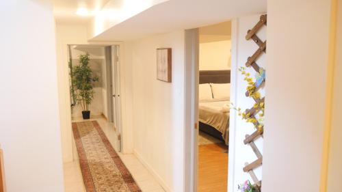 a hallway leading to a bedroom in a house at Richview Gardens Apartment in Toronto