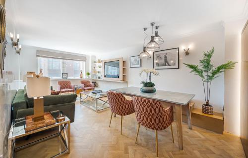 a living room with a couch and a table at Flat 9 in London