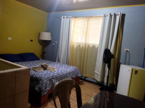 a small room with a table and a window at Recreo Verde Hot Springs & Spa in Marsella