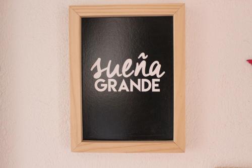a black chalkboard with arica grande written on it at Mesa De los Santos, Balcones De los Santos Cabaña Lounge Eucalipto in Los Santos