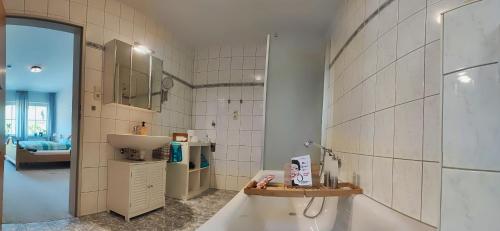 a bathroom with a sink and a toilet in a room at Im Beilsteiner Mühlental in Beilstein