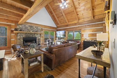 a living room with a couch and a fireplace at Good Dog Dreams in Valle Crucis