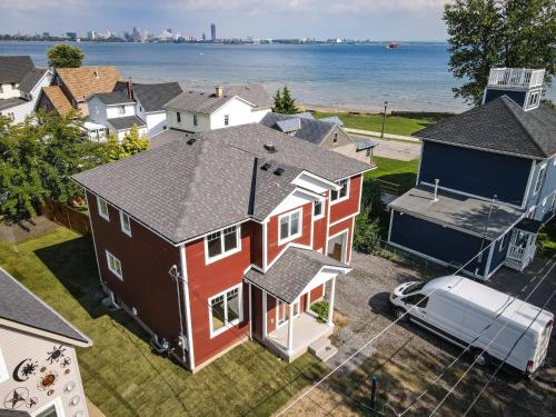 an aerial view of a house with a car in a yard at Lake view cottage with three ensuites and elevator in Fort Erie
