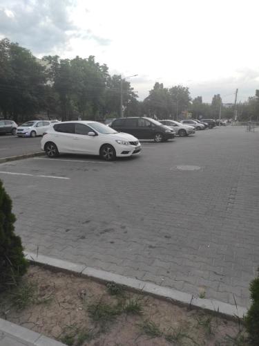 a row of parked cars in a parking lot at Hi-tech aparts in Chişinău