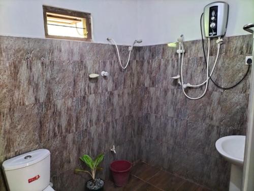 Een badkamer bij Sanjana Home Stay
