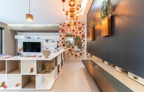 a room with a hallway with a sink and a mirror at Casa Magenta by Kukun in Mexico City