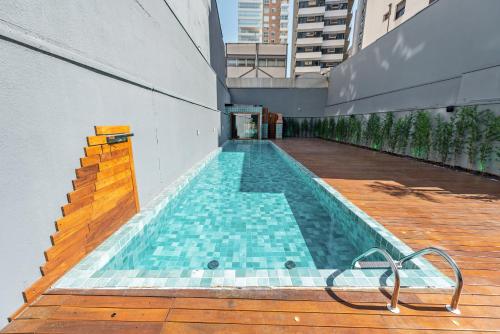 a swimming pool on the side of a building at Higienópolis The Standard Residence in Sao Paulo