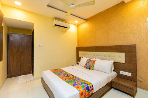 a bedroom with a large bed in a room at Hotel Elite 59 in Mumbai