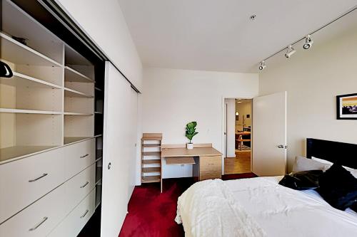 a bedroom with a bed and a desk at Downtown Dreaming in Seattle