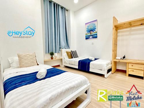 Postel nebo postele na pokoji v ubytování TheWave Residence By Heystay Management
