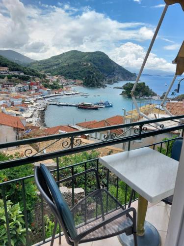 a balcony with a view of a body of water at Marthas Studios in Parga