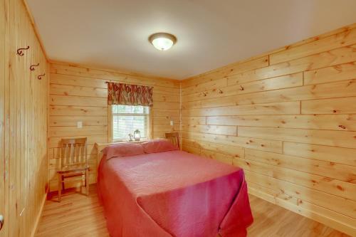 a bedroom with a bed in a wooden room at Lake Champlain Vacation Rental with Boat Dock! in Melville Landing