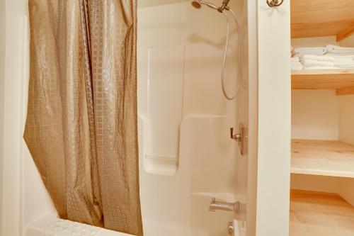 a shower with a shower curtain in a bathroom at Lake Champlain Vacation Rental with Boat Dock! in Melville Landing