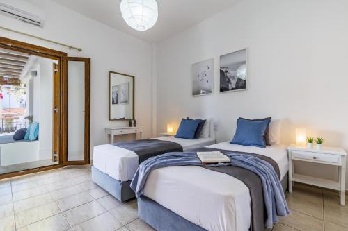 Säng eller sängar i ett rum på Sinioritsa's House Skopelos