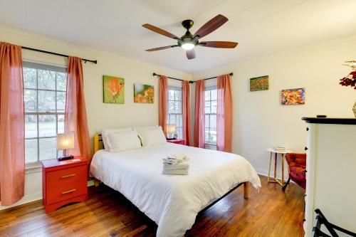 a bedroom with a bed and a ceiling fan at Charming Home about 4 Mi to Fort Worth Stockyards! in River Oaks