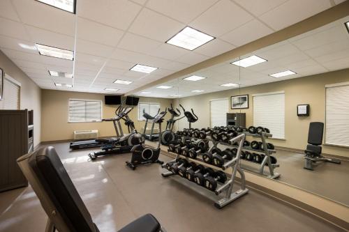 a gym with lots of treadmills and machines at Sleep Inn & Suites in Colby
