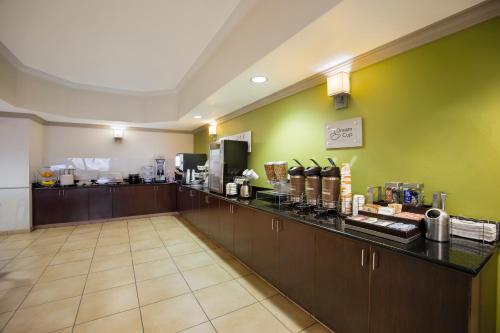 a hotel room with a counter with a coffee bar at Sleep Inn & Suites in Colby
