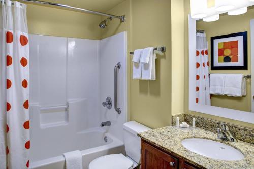 a bathroom with a shower toilet and a sink at TownePlace Suites by Marriott Findlay in Findlay