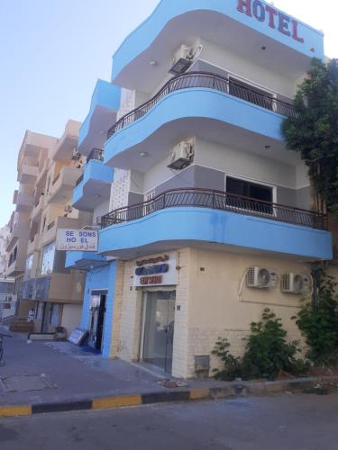 a building with a blue balcony on the side of it at Four Seasons Hotel in Hurghada