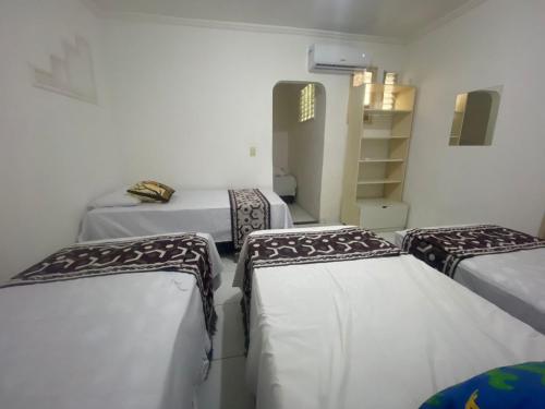 Ein Bett oder Betten in einem Zimmer der Unterkunft Temporada CG - Cantinho Nordestino