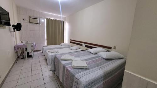 Una cama o camas en una habitación de Hotur Hotel