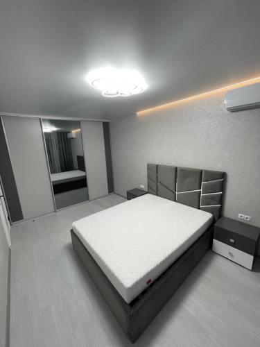 a bedroom with a large bed in a room at VIP new apartment Odessa in Odesa