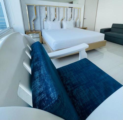 Un pat sau paturi într-o cameră la Hotel Lotto Boutique