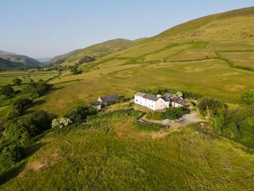an aerial view of a house in a field at Snowdonia Hideaway in Tywyn