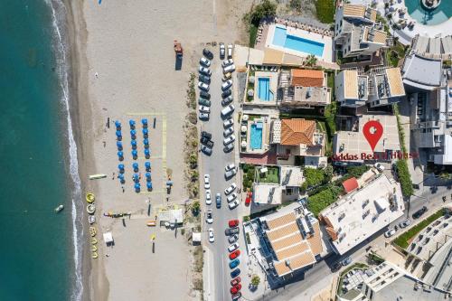 an aerial view of a beach with parked boats at Oddas Beach House in Rethymno Town