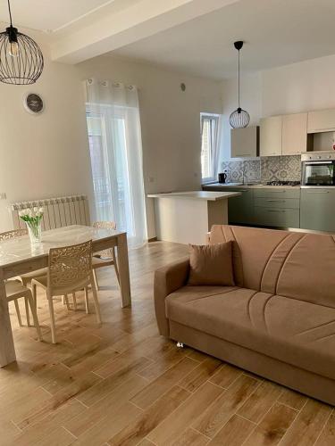 a living room with a couch and a table at Casa Vacanze Viola in San Benedetto del Tronto