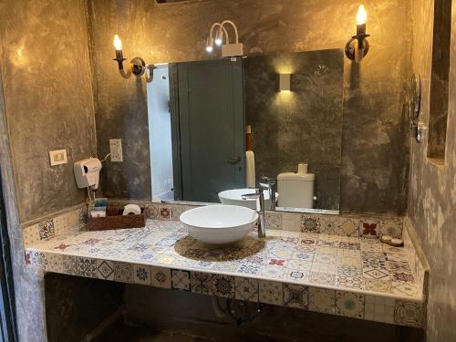 a bathroom with a sink and a mirror at Kiwengwa Beach Resort in Kiwengwa