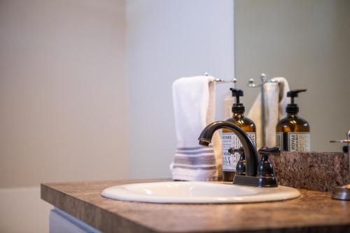 a bathroom counter with a sink and aaucet at South Zion Inn and Suites in Hildale