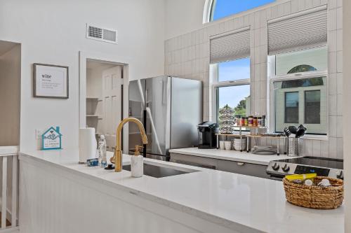 a kitchen with a sink and a refrigerator at Peaceful Phoenix Getaway - Central Location, Family-Friendly & Pool Table! in Phoenix