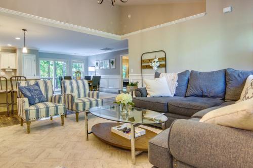 a living room with a blue couch and chairs at Anderson Lakefront Vacation Rental with Dock in Anderson