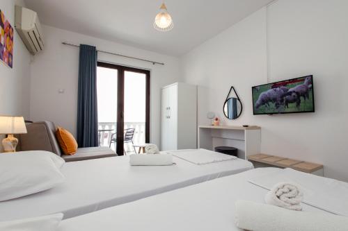 Una cama o camas en una habitación de Barba Rooms