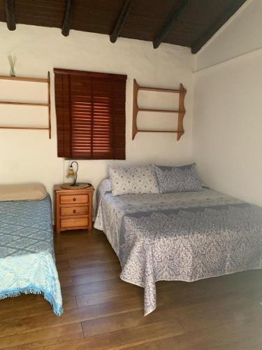 Postel nebo postele na pokoji v ubytování La Casita del Campo