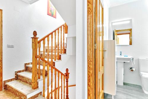 a bathroom and a staircase in a house at Espanhouse Sonia in La Zenia Playas de Orihuela in Orihuela
